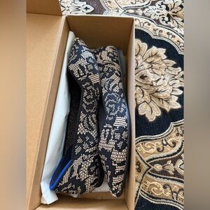 Rothy's Black & Cream Knit Flats